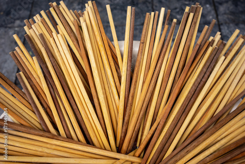 A bucket full of clean wooden chopsticks at a street stall in Hanoi Vietnam.