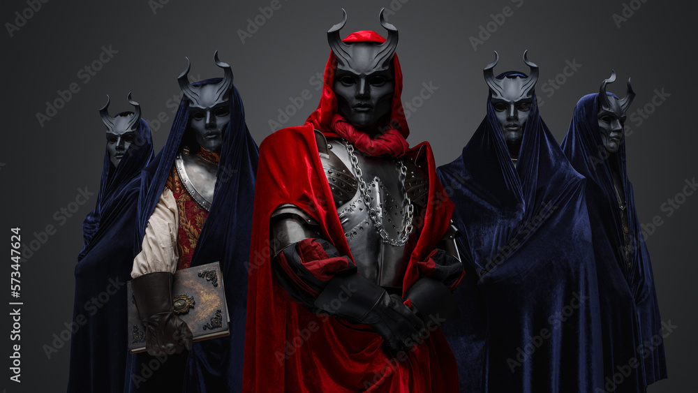 Studio shot of five members of occult brotherhood against gray background. Studio shot of five members of occult brotherhood against gray background.