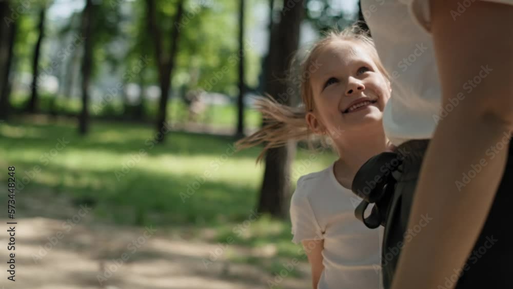 Caucasian girl playing at sliding in summer day. Shot with RED helium camera in 8K. Caucasian girl playing at sliding in summer day. Shot with RED helium camera in 8K.