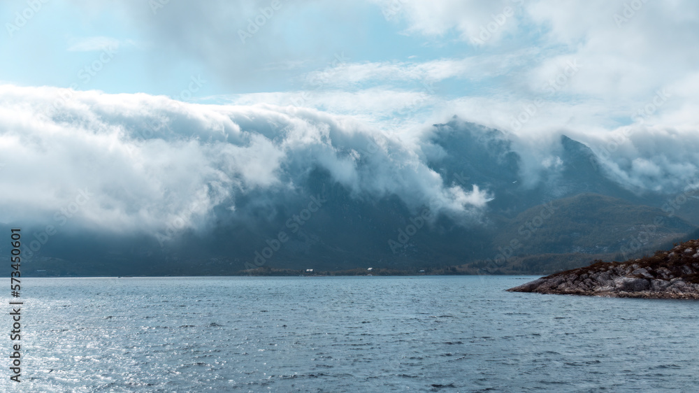 Fog rolling over Mountain Peaks in the Lofoten Archipelago (Norway) Fog rolling over Mountain Peaks in the Lofoten Archipelago (Norway)