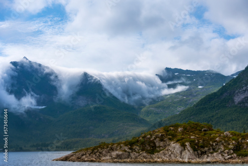 Fototapeta Naklejka Na Ścianę i Meble -  Fog rolling over Mountain Peaks in the Lofoten Archipelago (Norway)