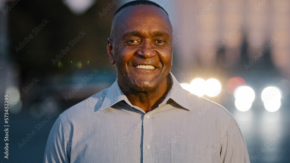 Close up male portrait in city outdoors African American adult middle-aged man posing on street happy smiling guy face with wrinkles successful mature businessman ethnic boss leader looking at camera Close up male portrait in city outdoors African American adult middle-aged man posing on street happy smiling guy face with wrinkles successful mature businessman ethnic boss leader looking at camera