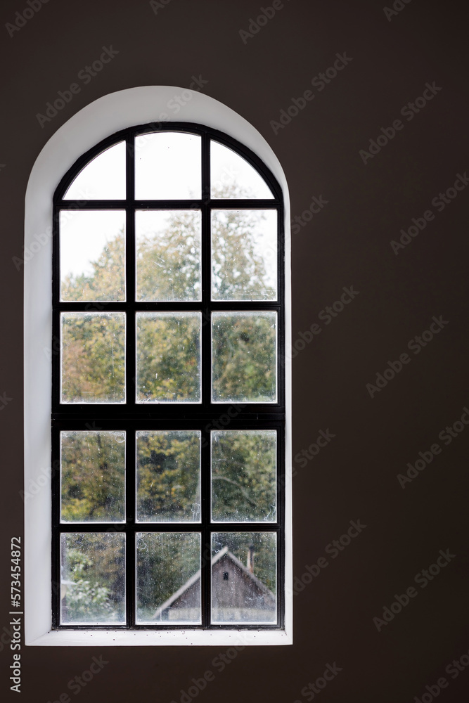 Dark interior with large window. Dark interior with large window.