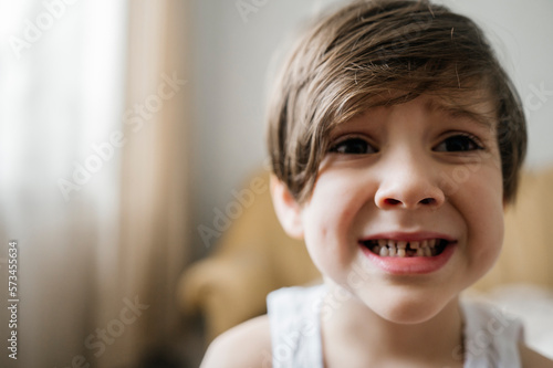 Boy with gap toothed at home photo