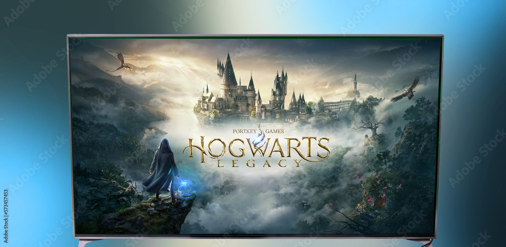 Naklejka premium Minsk, Belarus - February 19, 2023: game Hogwarts Legacy on a big TV. Play computer games