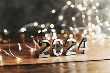 happy new year 2024 background new year holidays card with bright lights,gifts and bottle of hampagne