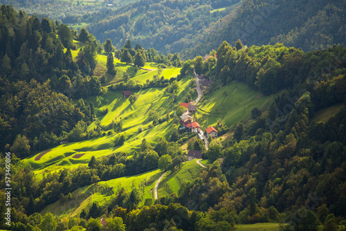 Slovenian mountain village seen from Krn mountain in Triglav National Park, Slovenia photo