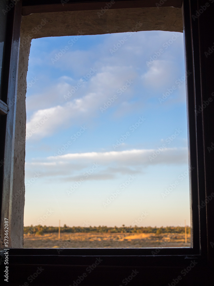 Cloudy sky through window, Erfoud, Morocco. Cloudy sky through window, Erfoud, Morocco.