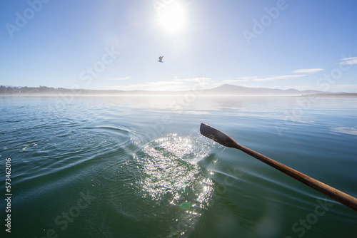 Oar in waters of Netarts Bay, Oregon, USA photo