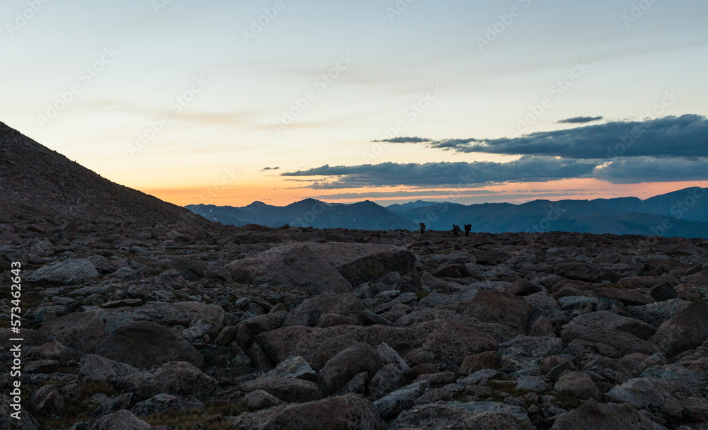 Silhouette Of Hikers On Rocky Landscape Near Longs Peak Silhouette Of Hikers On Rocky Landscape Near Longs Peak