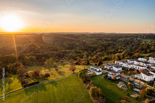 Germany, Baden-Wurttemberg, Baltmannsweiler, Aerial view of modern suburb at autumn sunset photo
