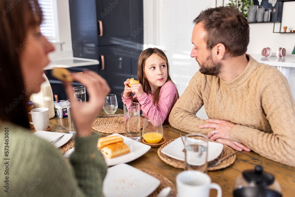 Girl having breakfast with family at home Girl having breakfast with family at home
