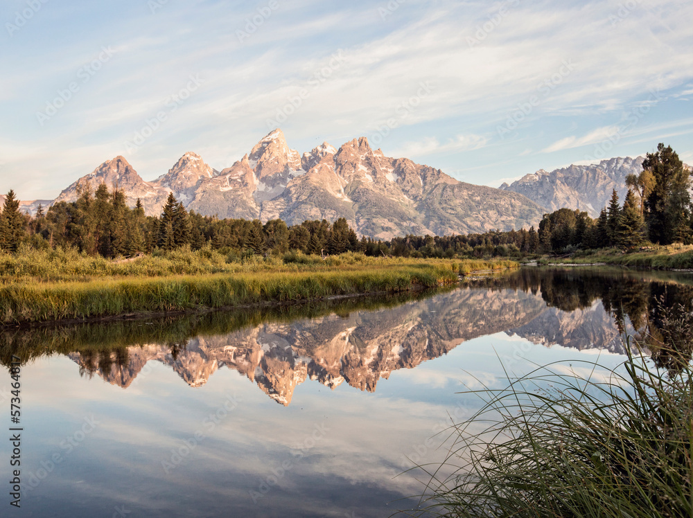 Teton Range reflecting on shiny surface of Snake River in Grand Teton National Park, Wyoming, USA Teton Range reflecting on shiny surface of Snake River in Grand Teton National Park, Wyoming, USA