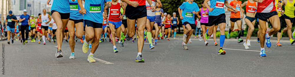 large group running athletes men and women run marathon
