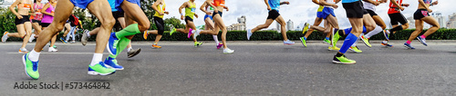 Photography group athletes runners men and women running city marathon