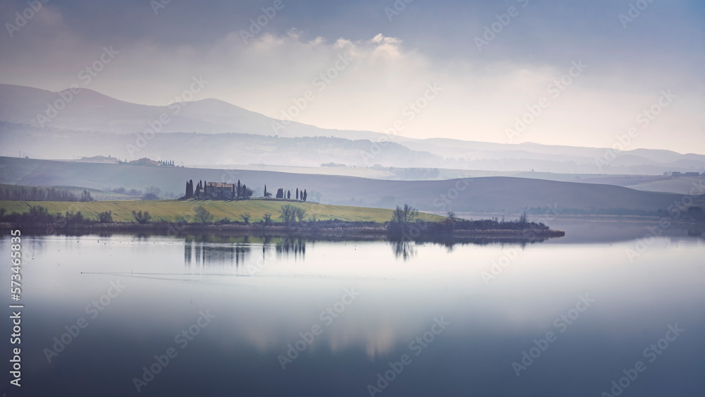 Lake Santa Luce view in a misty morning. Tuscany, Italy