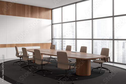 Modern office room interior with armchairs and table, panoramic window