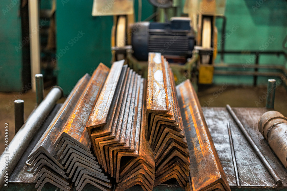 Blanks of metal corners at the factory for further processing. metal profile. Warehousing and storage of prepared elements for metalworking in a factory shop. Blanks of metal corners at the factory for further processing. metal profile. Warehousing and storage of prepared elements for metalworking in a factory shop.
