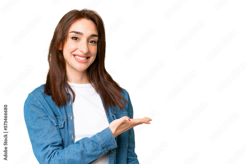 Young caucasian woman over isolated chroma key background presenting an idea while looking smiling towards Young caucasian woman over isolated chroma key background presenting an idea while looking smiling towards