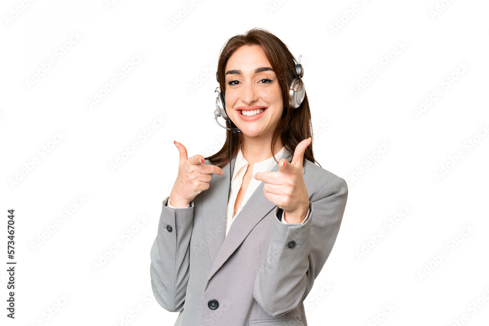 Telemarketer caucasian woman working with a headset over isolated chroma key background pointing to the front and smiling Telemarketer caucasian woman working with a headset over isolated chroma key background pointing to the front and smiling