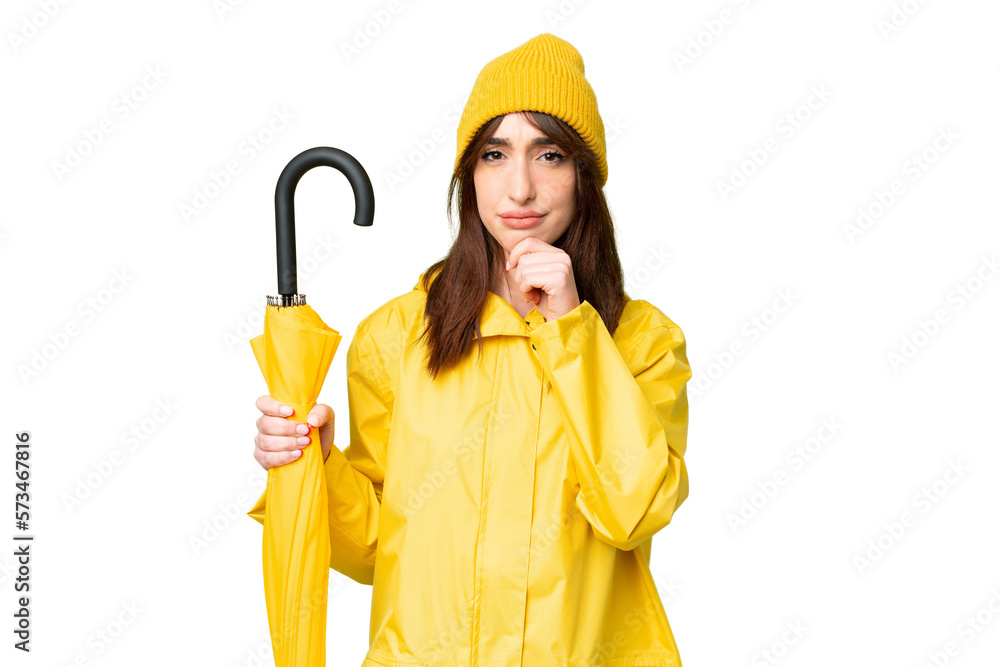 Young caucasian woman with rainproof coat and umbrella over isolated chroma key background thinking Young caucasian woman with rainproof coat and umbrella over isolated chroma key background thinking