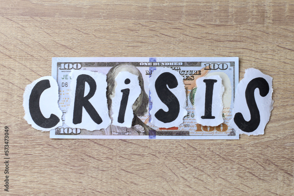 Fototapeta premium Crisis lettering on dollar banknote. Financial crisis concept.