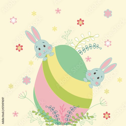 Easter egg with rabbits and flowers. The concept of the Easter holiday