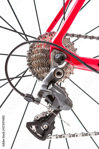 Road Cycling Ideas. Closeup of Rear Derailier and Rear Cassette with New Chain Against White. photo