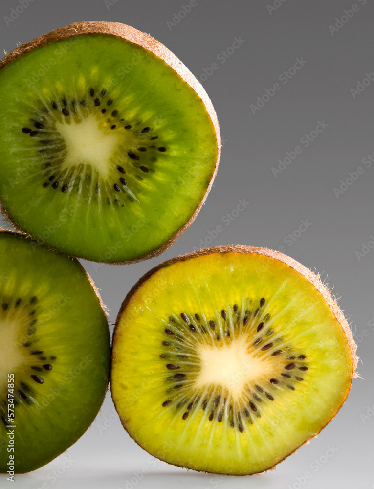 vertical sheets of kiwi in gray background