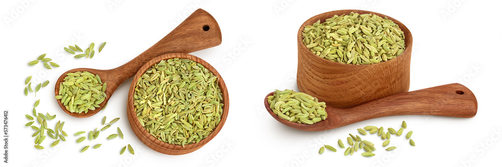 Dried fennel seeds in wooden bowl isolated on white background . Top view. Flat lay Dried fennel seeds in wooden bowl isolated on white background . Top view. Flat lay