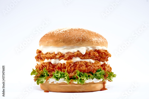 Double Chicken burger with ketchup, cheese, and mayonnaise on isolated white background.