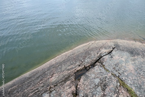 rocky coastline, huge stone in the water