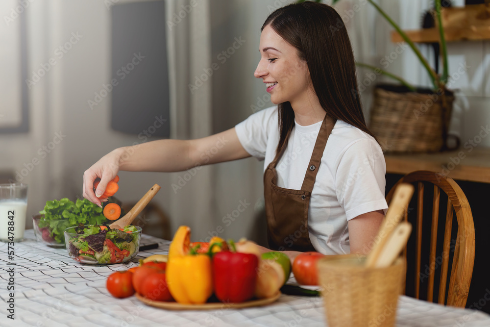 Young Healthy woman cooking healthy food in the kitchen at home. Healthy lifestyle, food, diet concept. Young Healthy woman cooking healthy food in the kitchen at home. Healthy lifestyle, food, diet concept.