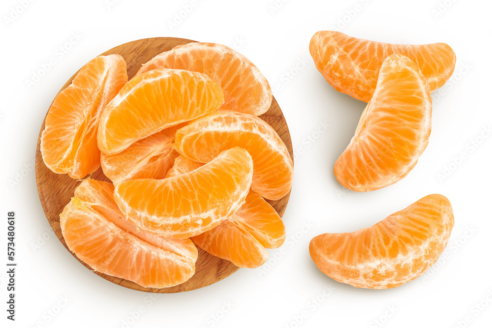 Tangerine or clementine slices in wooden bowl isolated on white background with full depth of field. Top view. Flat lay Tangerine or clementine slices in wooden bowl isolated on white background with full depth of field. Top view. Flat lay