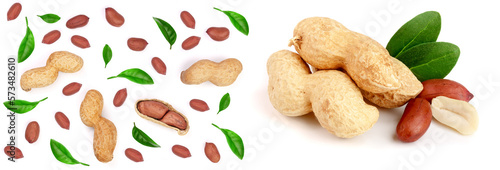 Peanuts decorated with green leaves isolated on white background, top view. Flat lay pattern