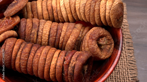 Fresh Figs or Anjeer fruit healthy vegan food concept organic dry fruits on wooden background.