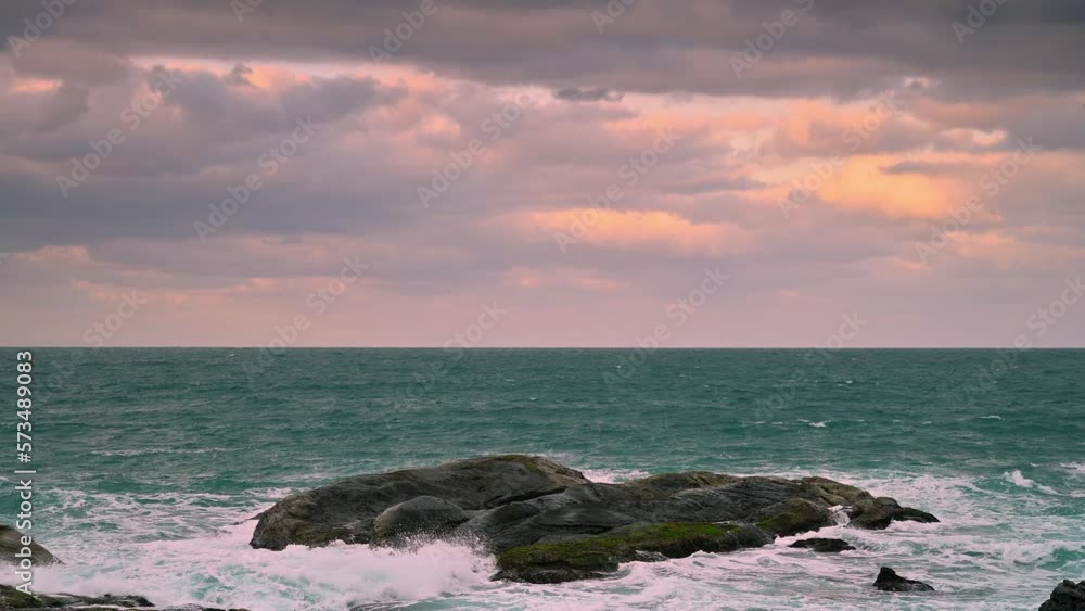 Looking at the vast sea and blowing the sea breeze, it is even more refreshing. Waves lapping at the rocks at dusk. Badouzi Coastal Park, Keelung City, Taiwan Looking at the vast sea and blowing the sea breeze, it is even more refreshing. Waves lapping at the rocks at dusk. Badouzi Coastal Park, Keelung City, Taiwan