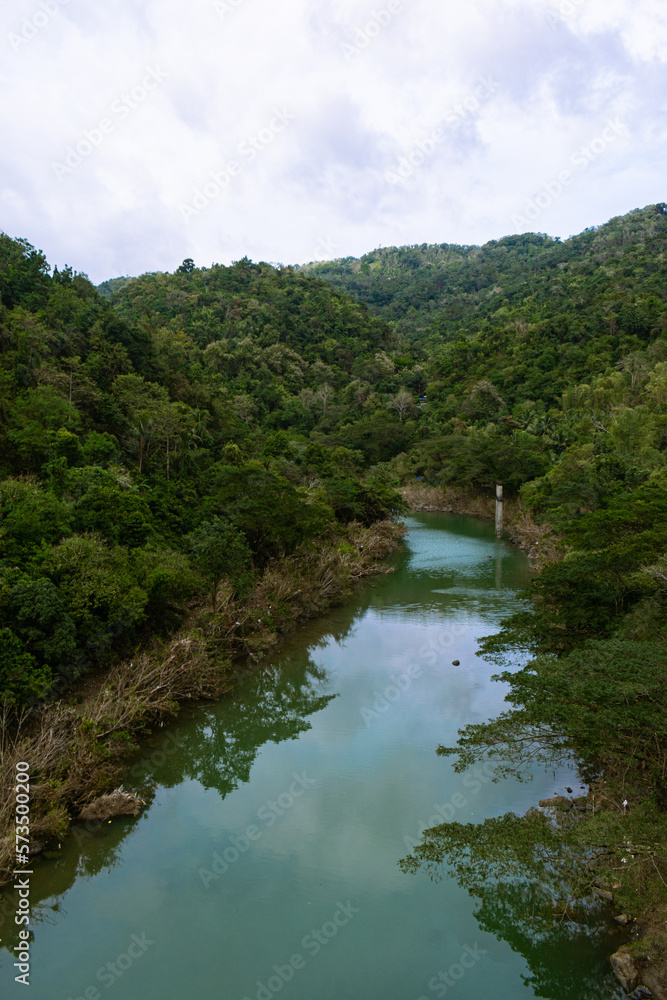 Clean river in the tropical mountains. Portrait. Bitbit River, Bulacan, Philippines Clean river in the tropical mountains. Portrait. Bitbit River, Bulacan, Philippines