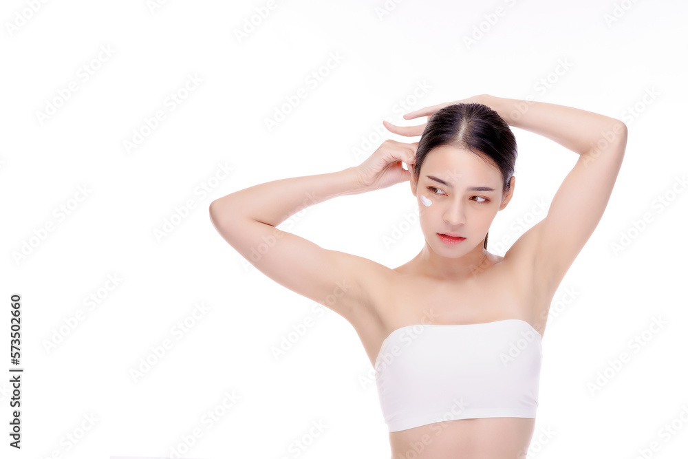 Portrait of young girl adjusts her hair in a white shirt only at the chest. Fashionable young woman tying her beautiful hair. Youth, tender age and lifestyle concept. Portrait of young girl adjusts her hair in a white shirt only at the chest. Fashionable young woman tying her beautiful hair. Youth, tender age and lifestyle concept.