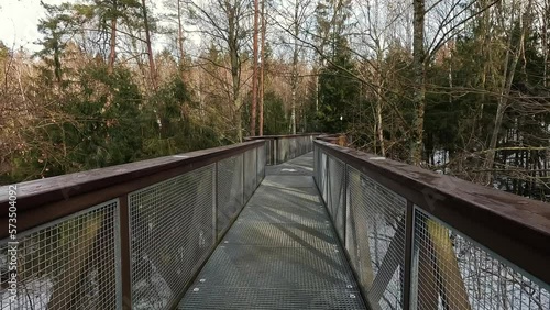 View of Anyksciai Laju Takas, Treetop Walking Path Complex With a Walkway, an Information Center and Observation Tower, Located in Anyksciai, Lithuania Near Sventoji River. Sunny Winter Day photo