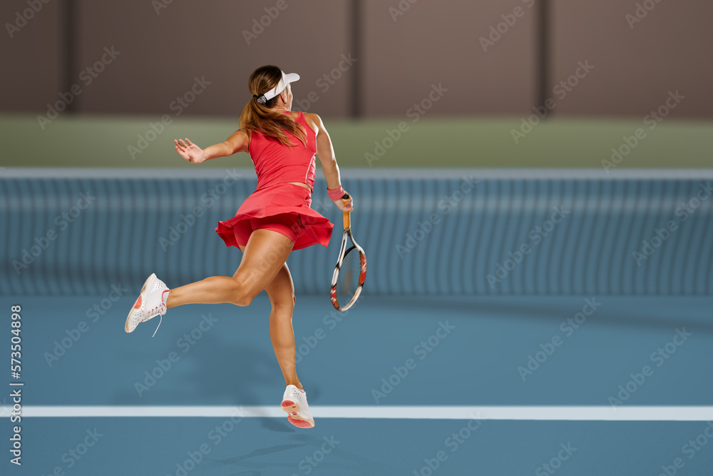 Back view of professional female tennis player serving