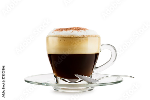 Cappuccino in glass cup with saucer and spoon on white background
