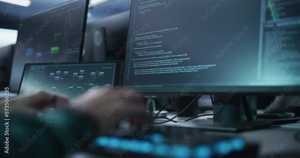 Close Up of a Software Developer Working on a Desktop Computer, Typing Programming Code on Keyboard. Professional Employee Doing Work in a Cyber Security Technology Company