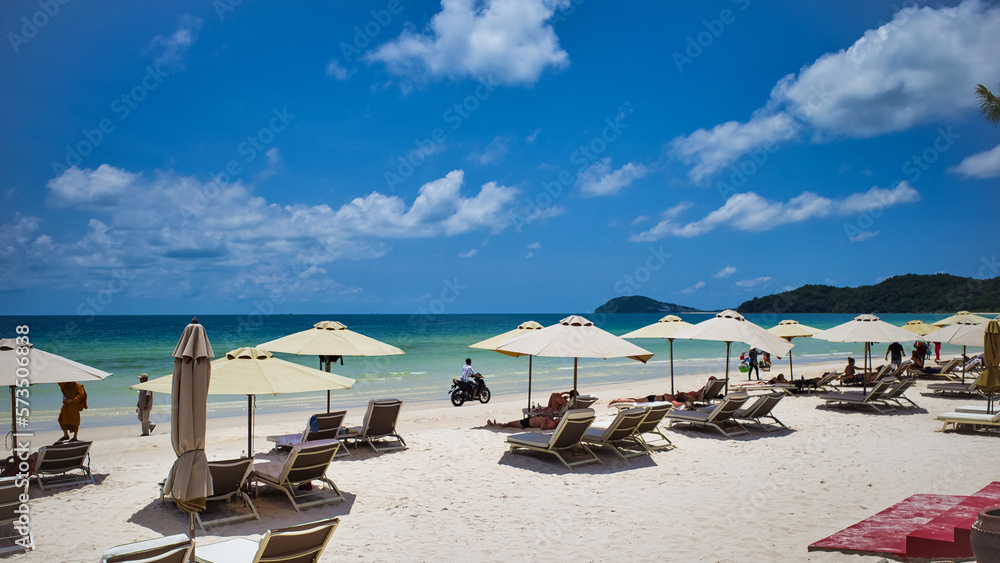 Phu Quoc island, Vietnam - March 31, 2019: A beach of white sand, equipped with sun loungers and umbrellas for relaxing. Beautiful coast of the South China Sea
