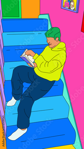 Boy with wavy hair sitting on the stairs reading a book photo