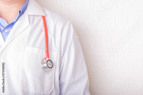 Close Up Doctor in white coat with red stethoscope in hospital or clinic