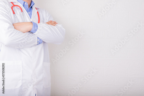 Doctor Standing on front of wall for WORLD HEALTH DAY or DOCTOR Day