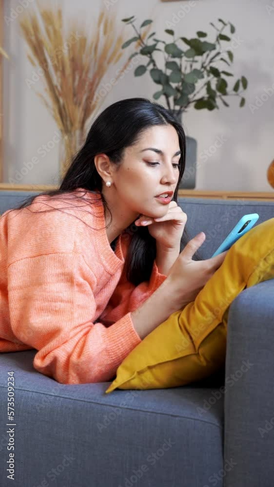 Happy woman using smartphone at home Happy woman using smartphone at home