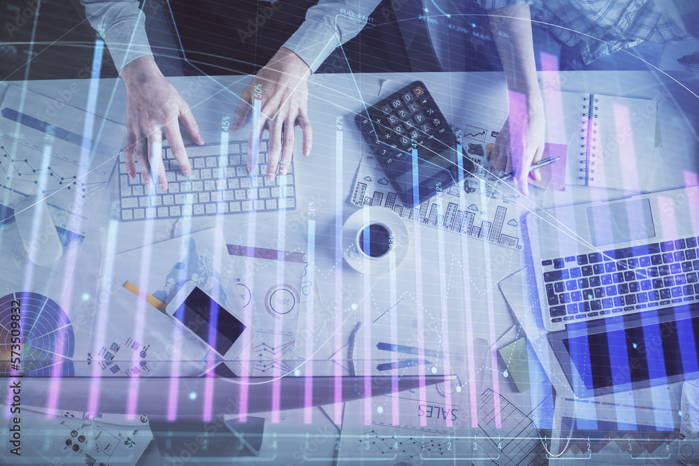 Double exposure of man and woman working together and financial chart hologram drawing. market analysis concept. Computer background. Top View. Double exposure of man and woman working together and financial chart hologram drawing. market analysis concept. Computer background. Top View.
