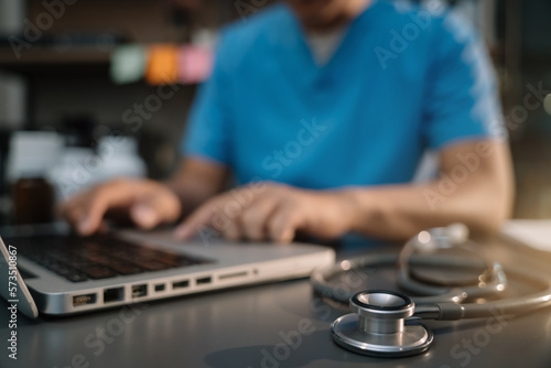 Close up of a stethoscope and digital laptop healthcare and network on modern